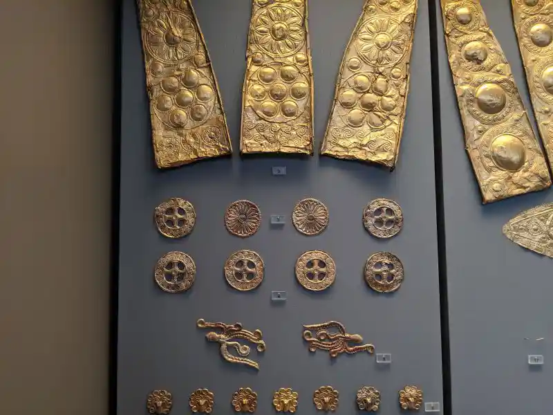 Gold diadem pieces, rosettes, and octopus-shaped cut-outs from Grave III, Mycenae